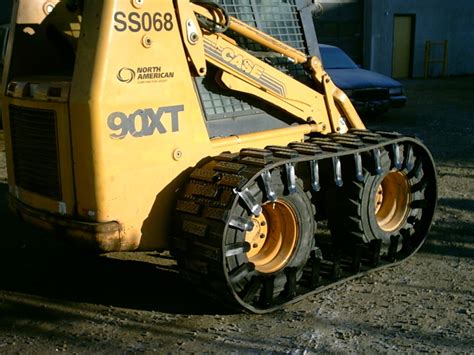 over the tire skid steer tracks in snow|bobcat rubber tracks over tires.